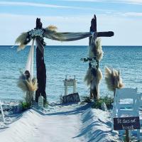 My Favorite arbor, the Driftwood Arbor with pompous grass and 30 chairs with the Corinthians 13 versus 4-7...